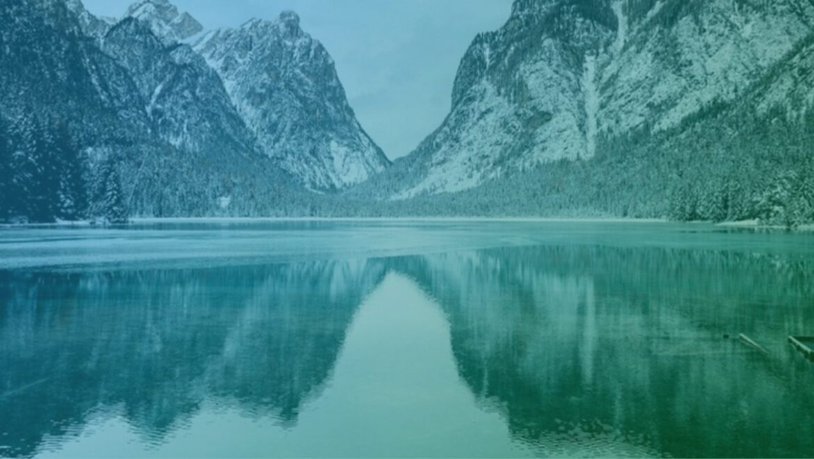 Mountains reflected in a frozen lake