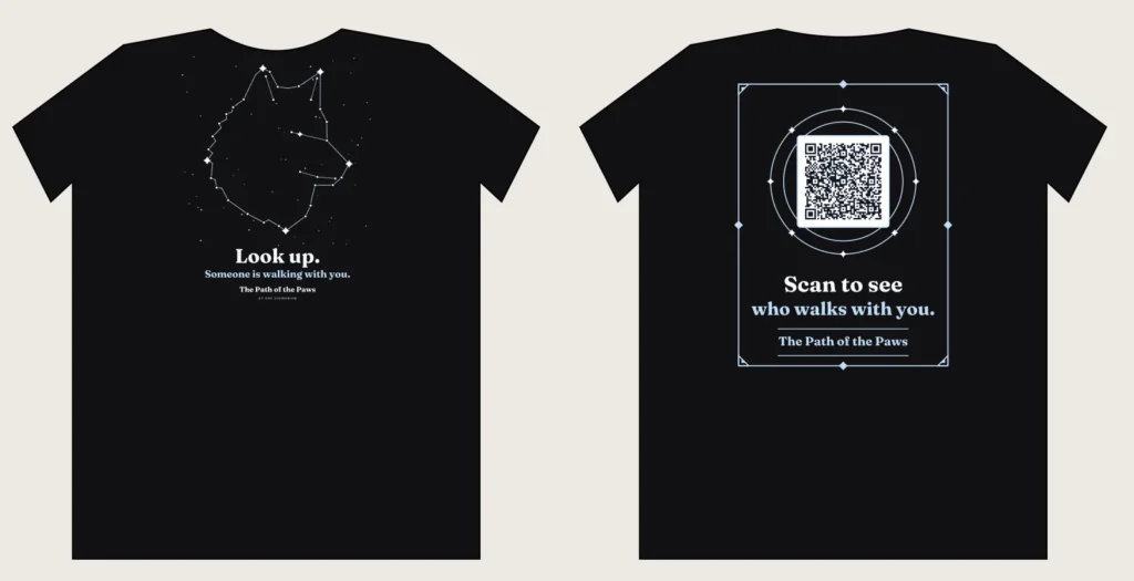 Black The Path of the Paws shirt with a wolf head constellation and the slogan Look up, front and back with QR code